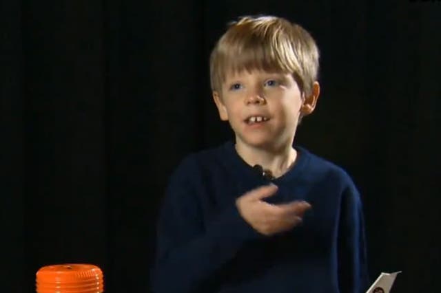 6-year-old Connor Johnson is pictured with his piggy bank (left) in a screengrab from USA Today.