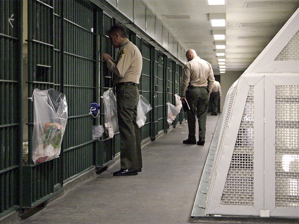 Los Angeles County Sheriff's deputies inspect cell blocks at the Men's Central Jail in downtown Los Angeles