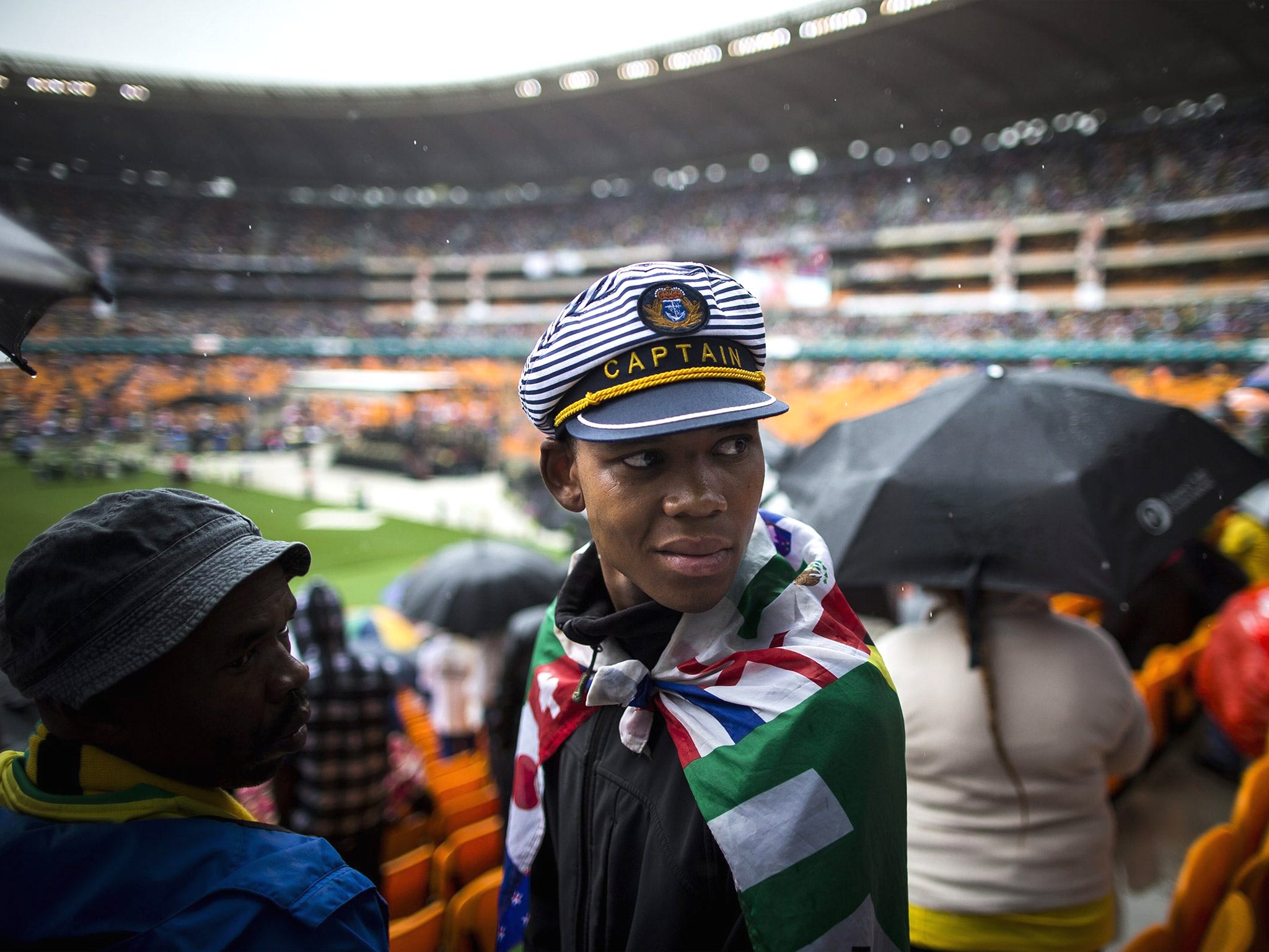 Thousands of mourners at the official memorial ceremony for Nelson Mandela booed and jeered the current president Jacob Zuma as the ceremony in the pouring rain veered wildly off script