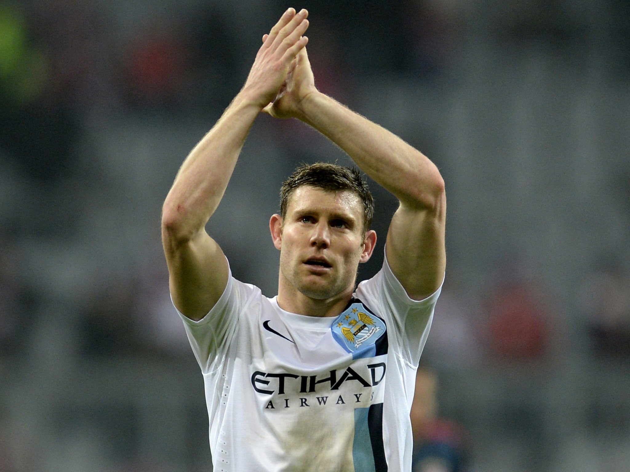 James Milner applauds the fans after Manchester City's 3-2 win at Bayern Munich