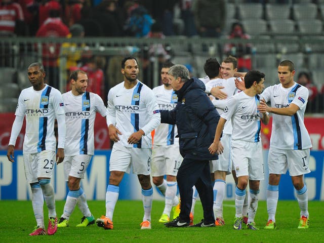 Manchester City manager Manuel Pelegrini congratulates his players after their successful 3-2 victory over Champions League holders Bayern Munich