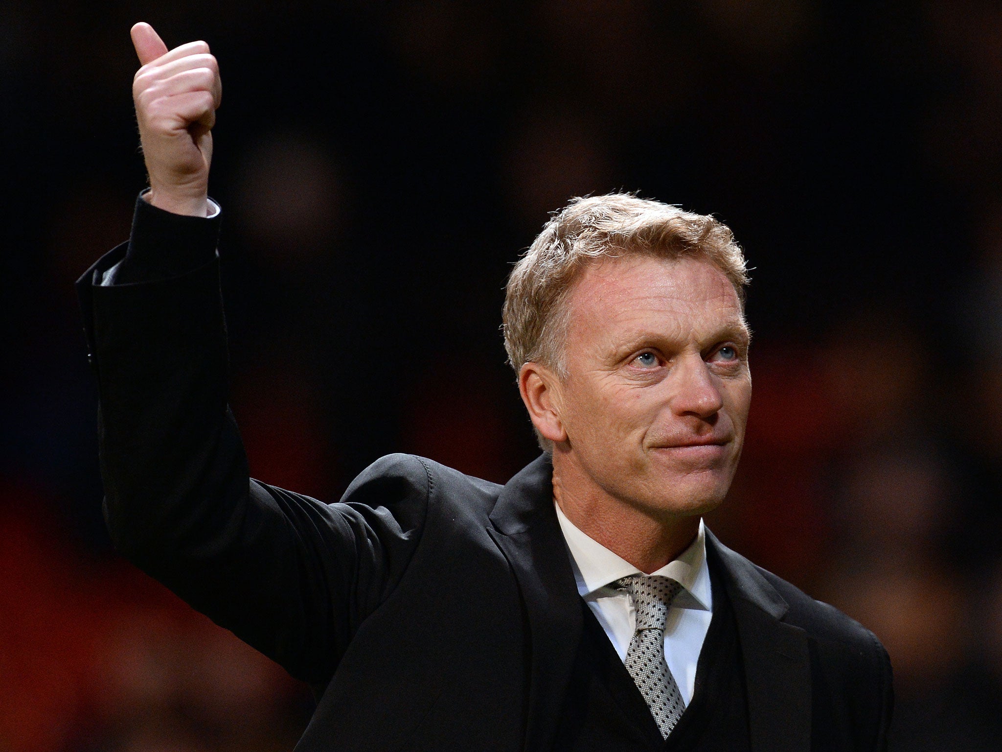 Manchester United manager David Moyes salutes the home fans after their Champions League victory over Shakhtar Donetsk