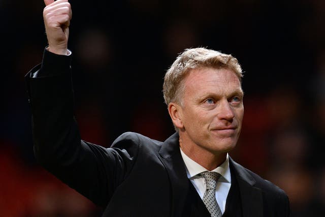 Manchester United manager David Moyes salutes the home fans after their Champions League victory over Shakhtar Donetsk