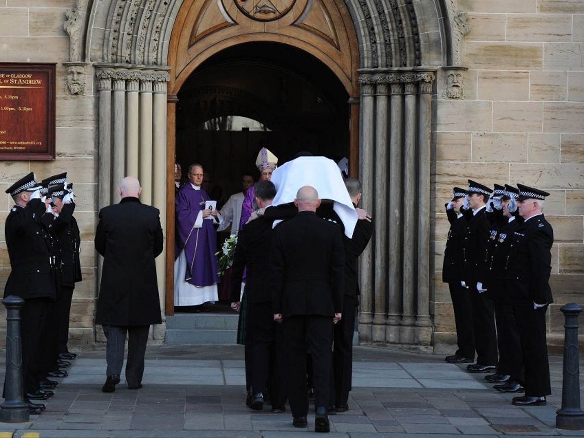The body of Pc Kirsty Nelis is carried into St Andrews Cathedral during her funeral in Glasgow after a police helicopter crashed