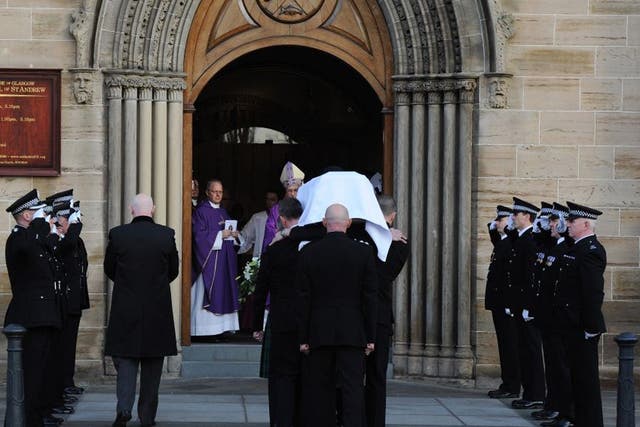 The  body of Pc Kirsty Nelis is carried into St Andrews Cathedral during her funeral in Glasgow after a police helicopter crashed