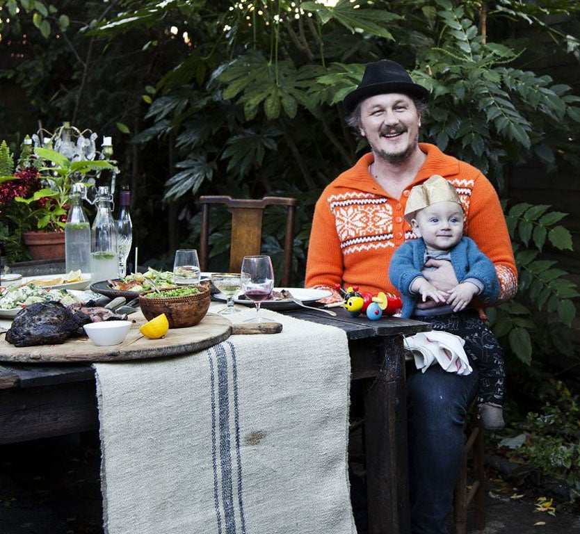 Miles Kirby and his son Eli with his New Zealand-style Yuletide meal