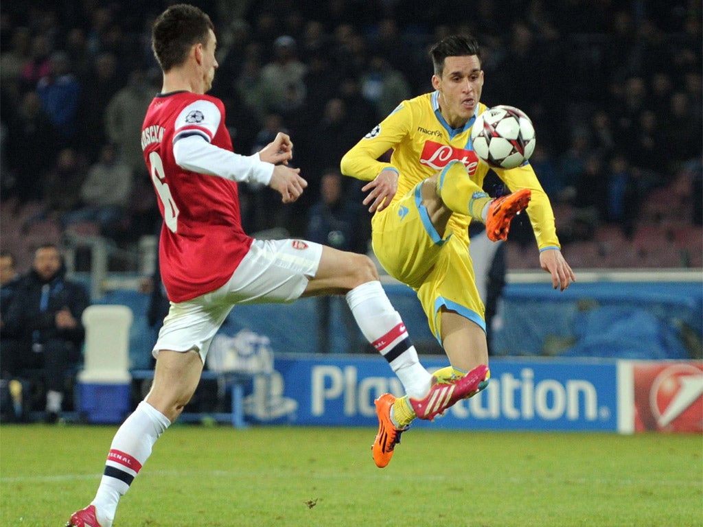 Jose Callejon beats Laurent Koscielny to the ball to score Napoli's second