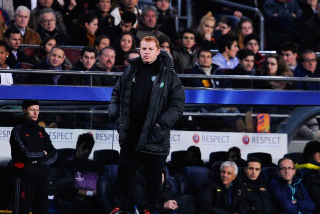 Celtic manager Neil Lennon watches on as his side slump to a 6-1 defeat at Barcelona