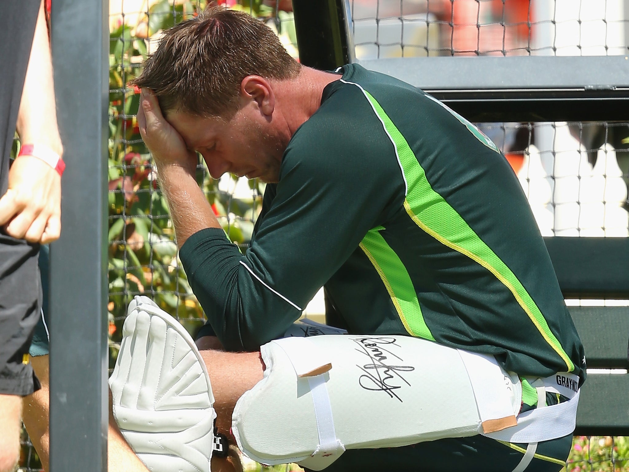 Australia's James Faulkner looks dejected after suffering a broken thumb when he was hit on the hand during a nets session