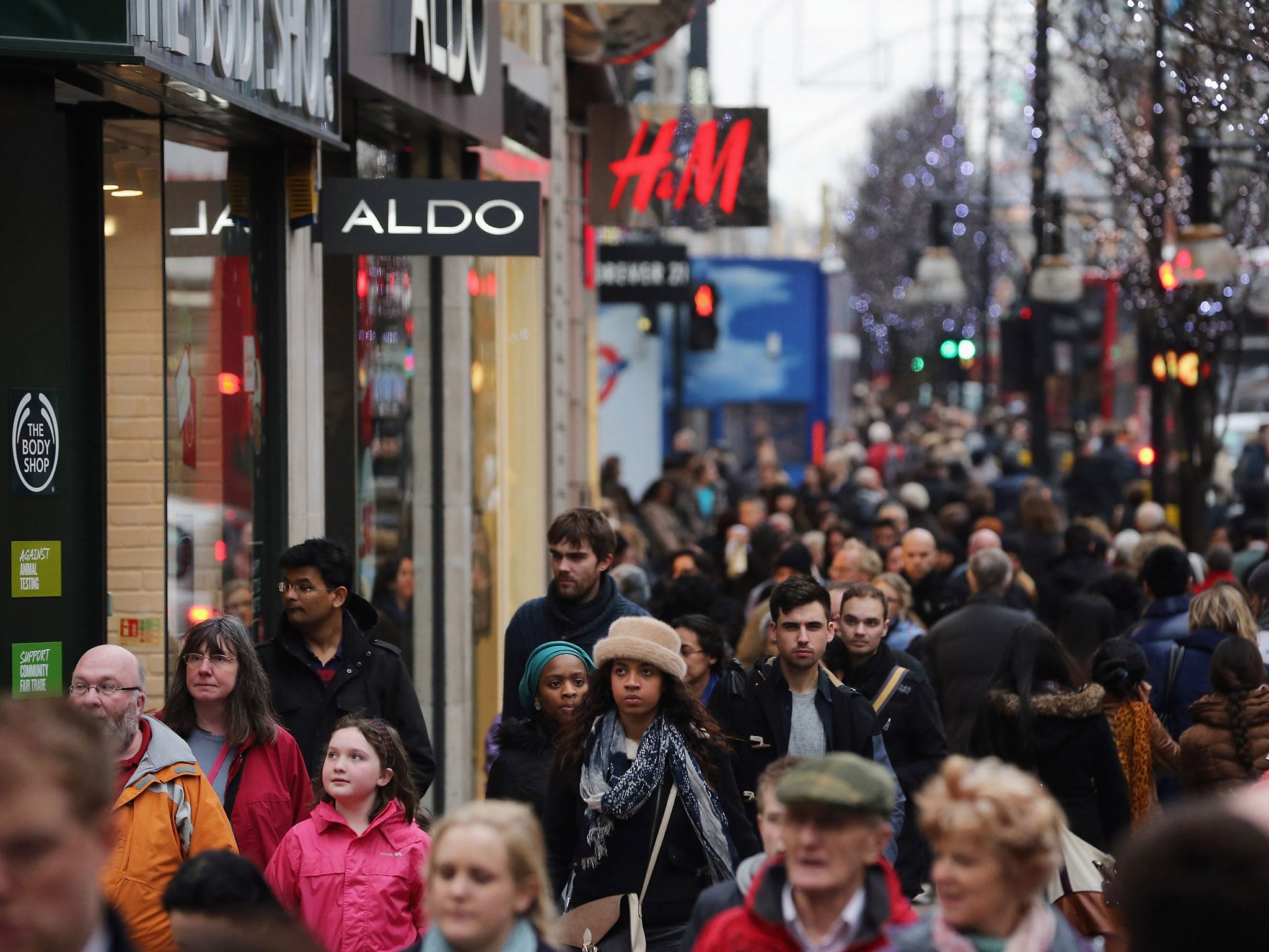 British economy to surpass pre-recession peak in 2014 driven by surge in household spending