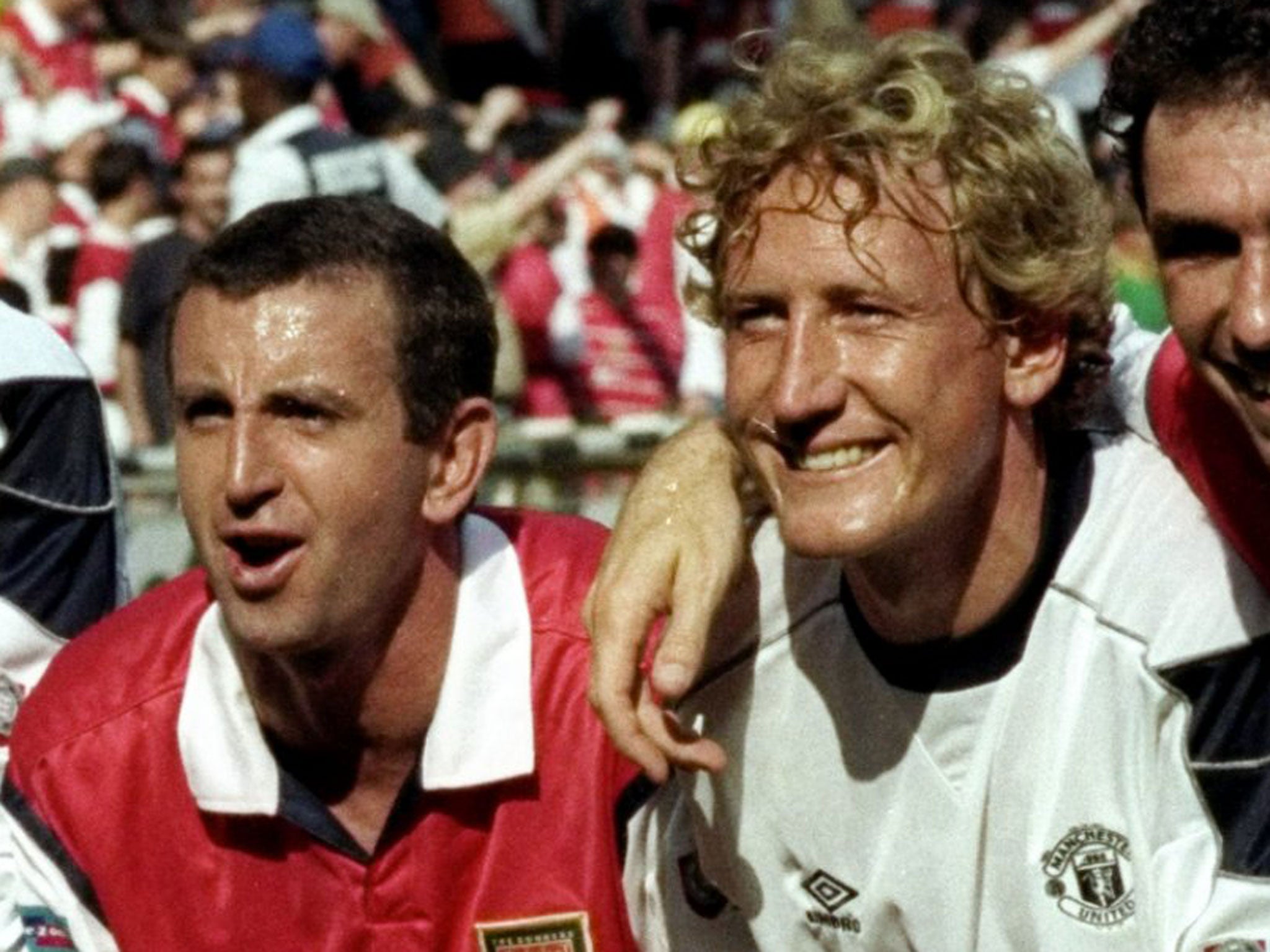 Nigel Winterburn (left) and Ray Parlour celebrate Arsenal's Charity Shield triumph in 1999