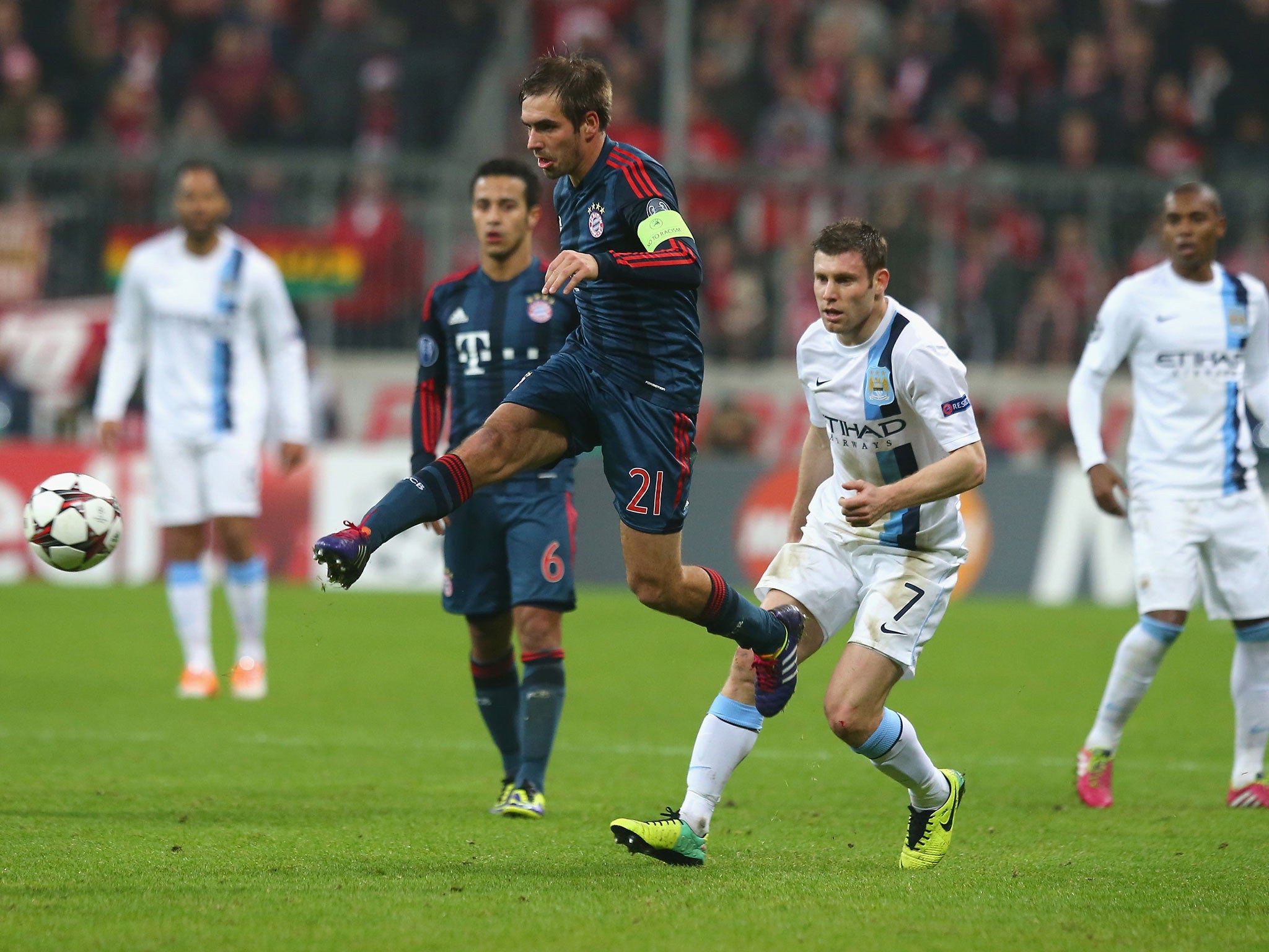 Philipp Lahm of Bayern Munich runs with the ball