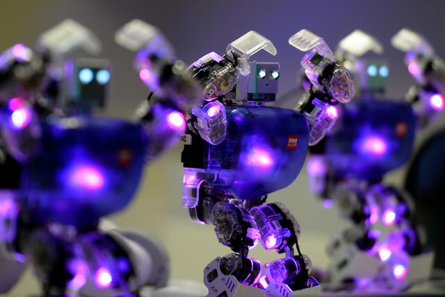 A picture taken on November 28, 2013 shows humanoid robots dancing at 'The Robot Museum' in Madrid.