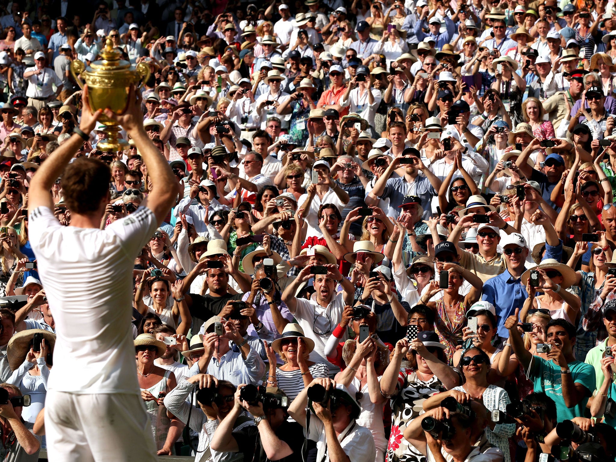 Andy Murray takes the applause from the Centre Court crowd after his victory over Novak Djokovic in the final
