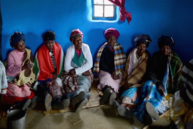 Xhosa women inside a house in the nearby village of Mvezo, where Mandela was born