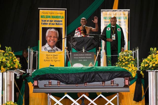 A speaker addresses mourners during the ANC ceremony for former South African president Nelson Mandela.
