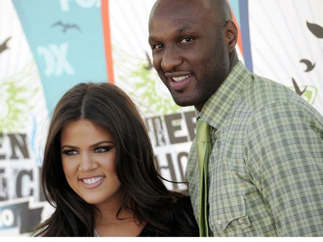 Khloe Kardashian and Lamar Odom arriving at the Teen Choice Awards in Universal City, Calif. Kardashian is reportedly filing for divorce from Odom Friday Dec. 13, 2013, her husband of more than four years, citing irreconcilable differences
