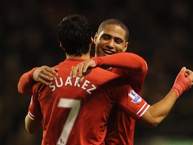 Luis Suarez and Glen Johnson celebrate for Liverpool