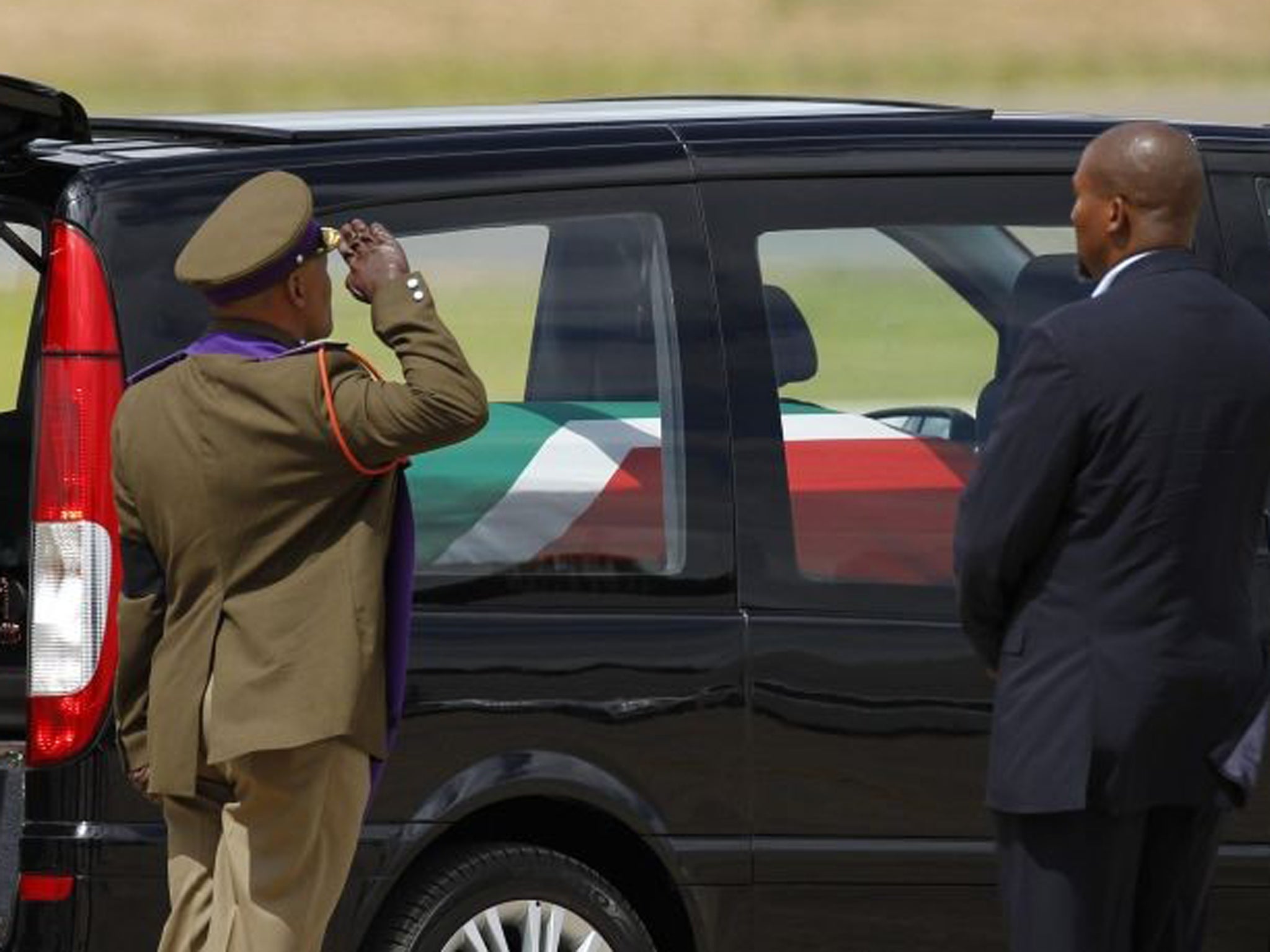 Nelson Mandela's flag-draped coffin leaves the Mthata airport