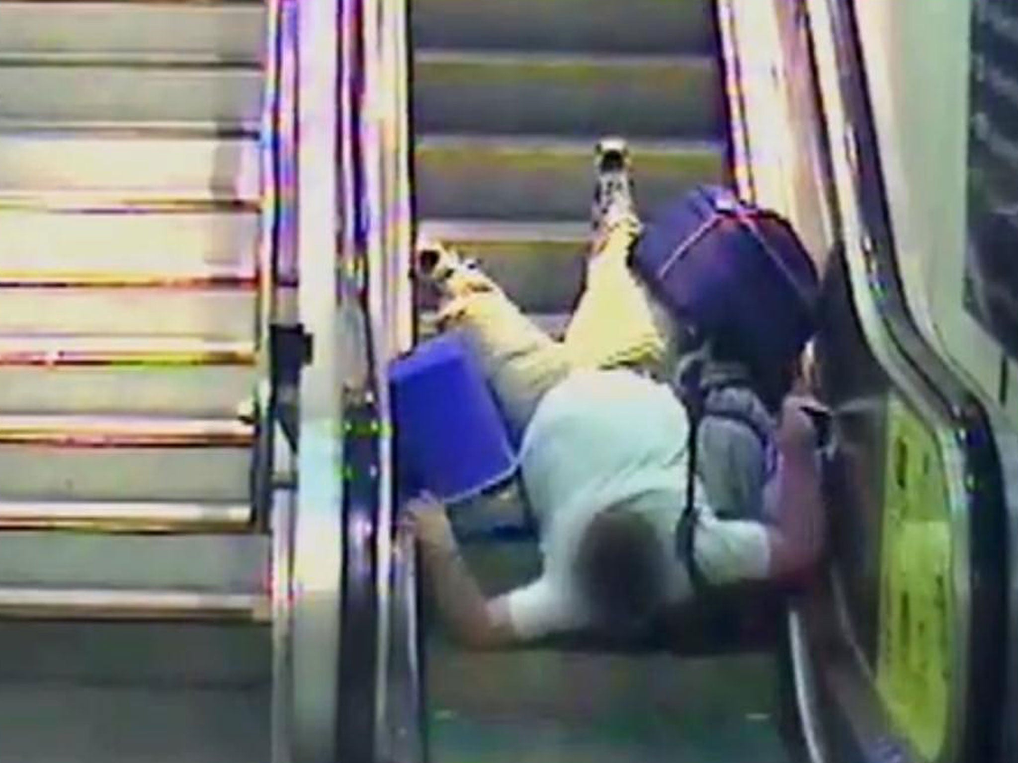 This unfortunate traveller was dragged up the escalators along with all of their luggage