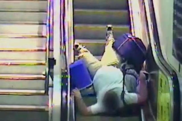 This unfortunate traveller was dragged up the escalators along with all of their luggage 