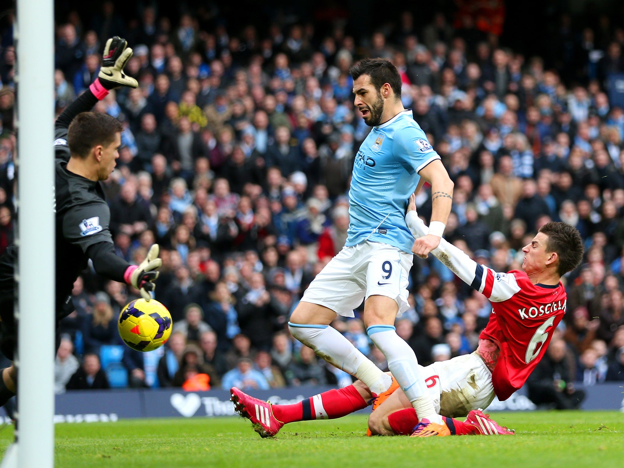 Laurent Koscielny suffered a 'deep laceration to the knee' in this collision with Alvaro Negredo