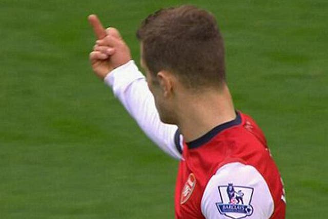 Television camera's caught Jack Wilshere making a gesture towards the Manchester City fans