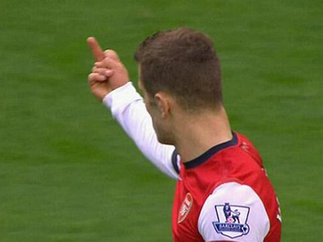 Television camera's caught Jack Wilshere making a gesture towards the Manchester City fans