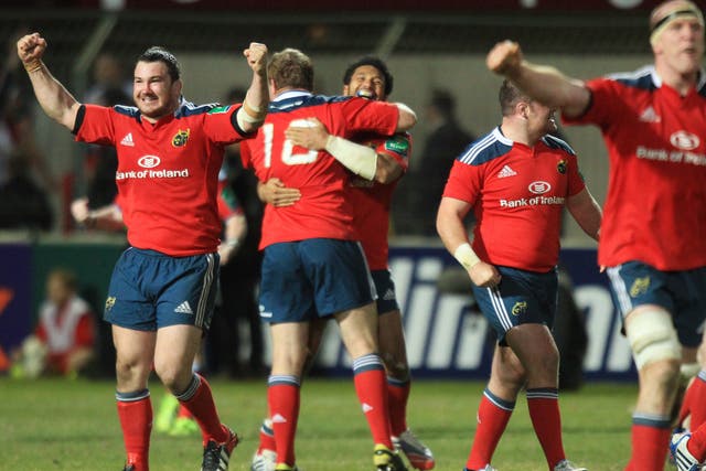 Munster celebrate after their late victory over Perpignan