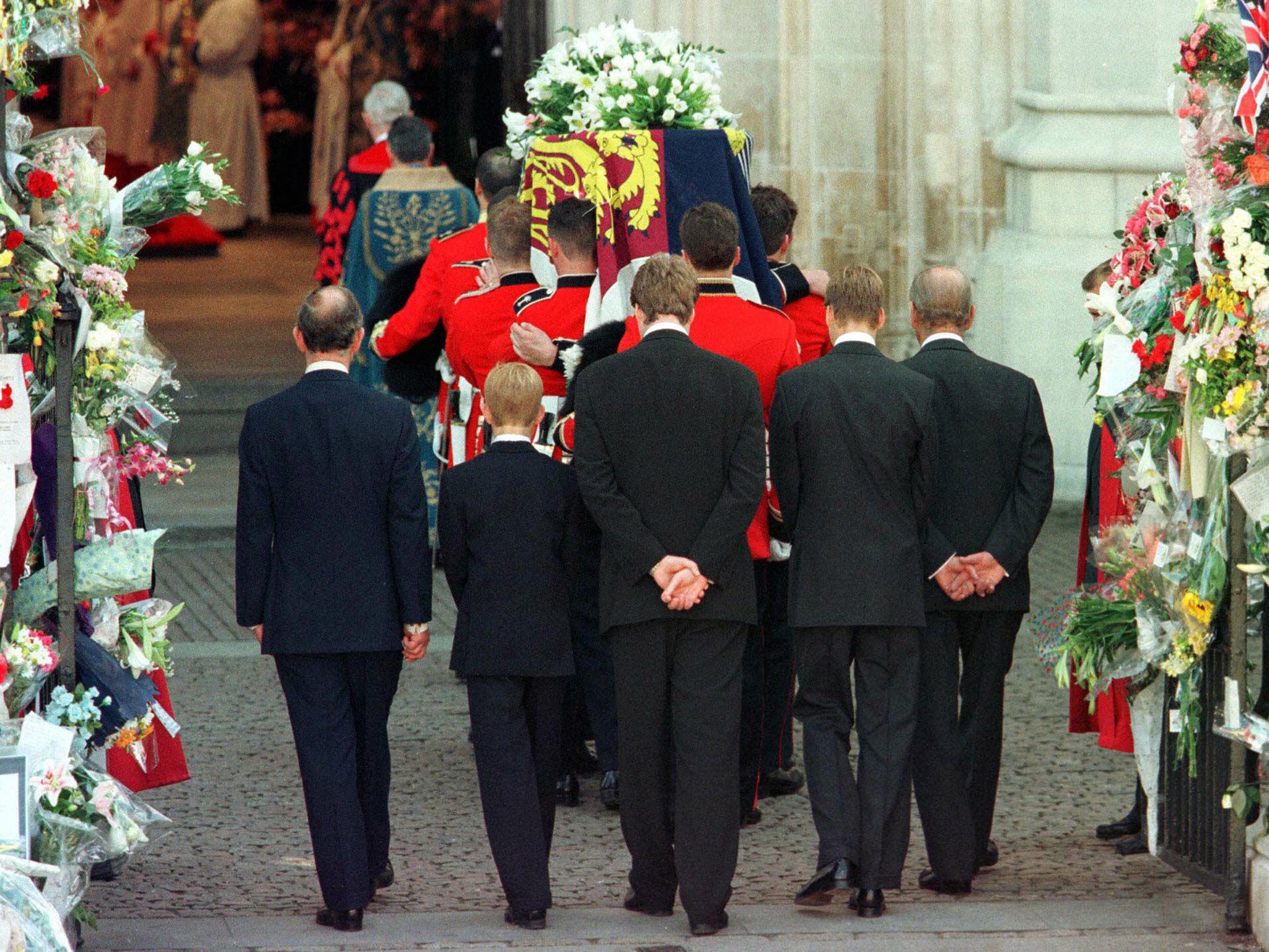 Diana's body enters Westminster Abbey followed by her sons, former husband and father-in-law and her brother