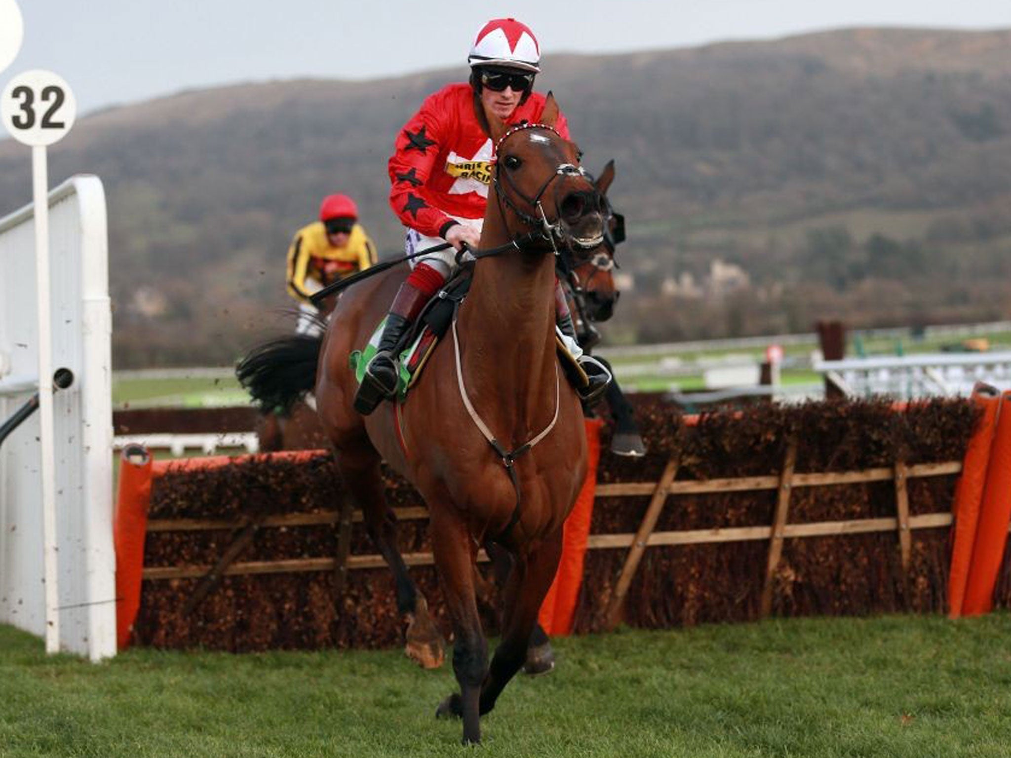 Proper Champion: The New One, ridden by Sam Twiston-Davies, heads for victory in the International Hurdle