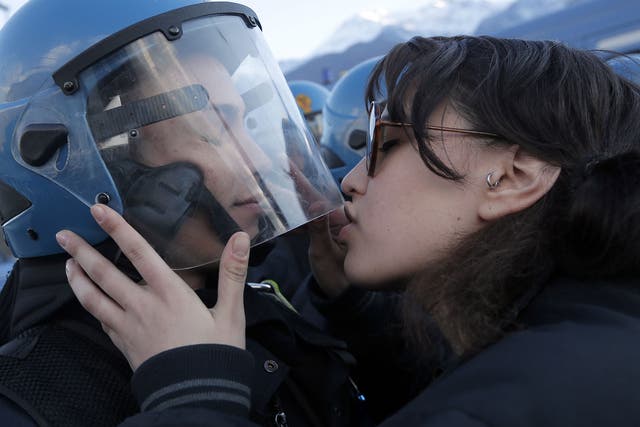The 20-year-old student was photographed kissing officer Salvatore Piccione during a protest against a planned rail link in Northern Italy. 
