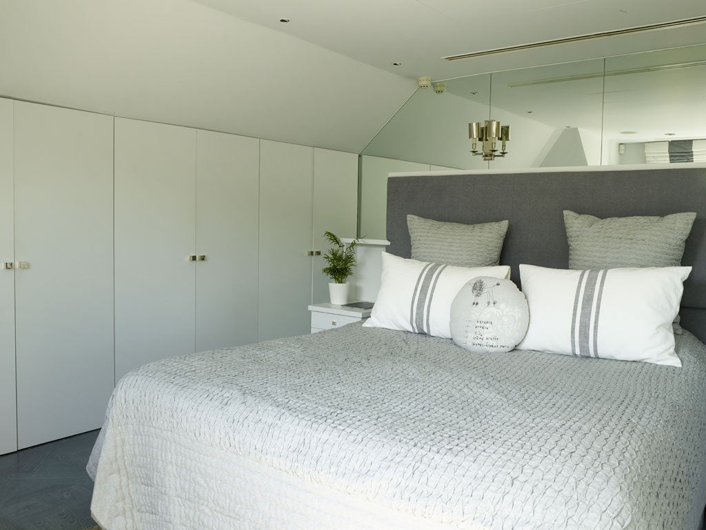 The top-floor bedroom was designed specifically to make room for the large bed