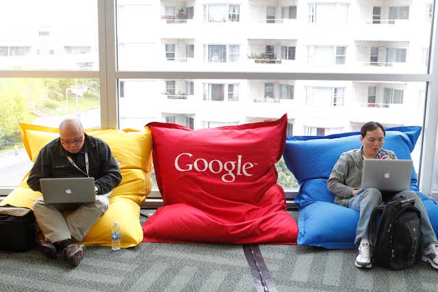 Attendees Dominie Liang (L) and Ruslan Belkin utilize the common area at the Google I/O Developers Conference in the Moscone Center in San Francisco, California, May 11, 2011.