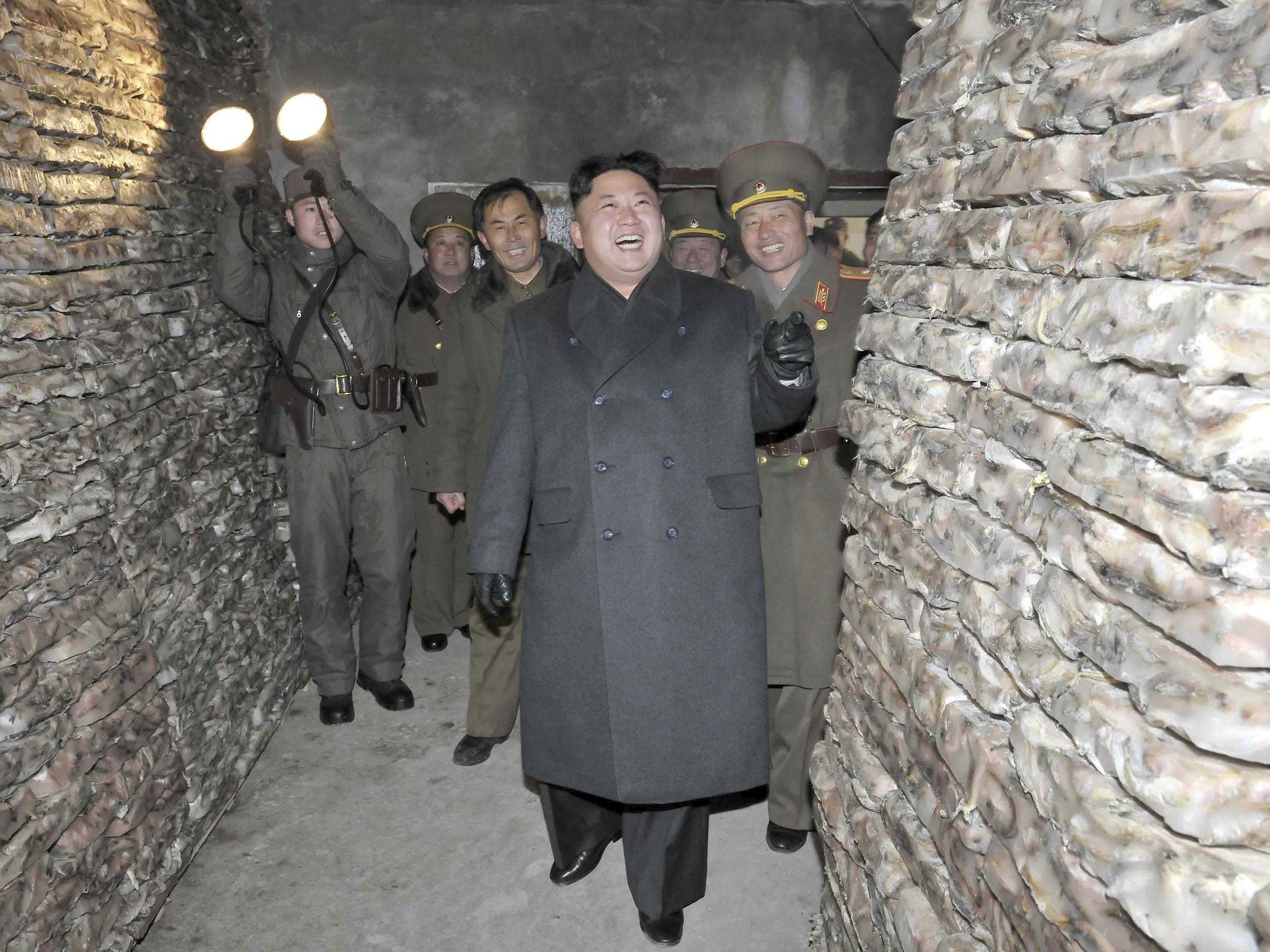 Kim Jong un laughs as he inspects the August 25 Fisheries Station under KPA 313 Unit