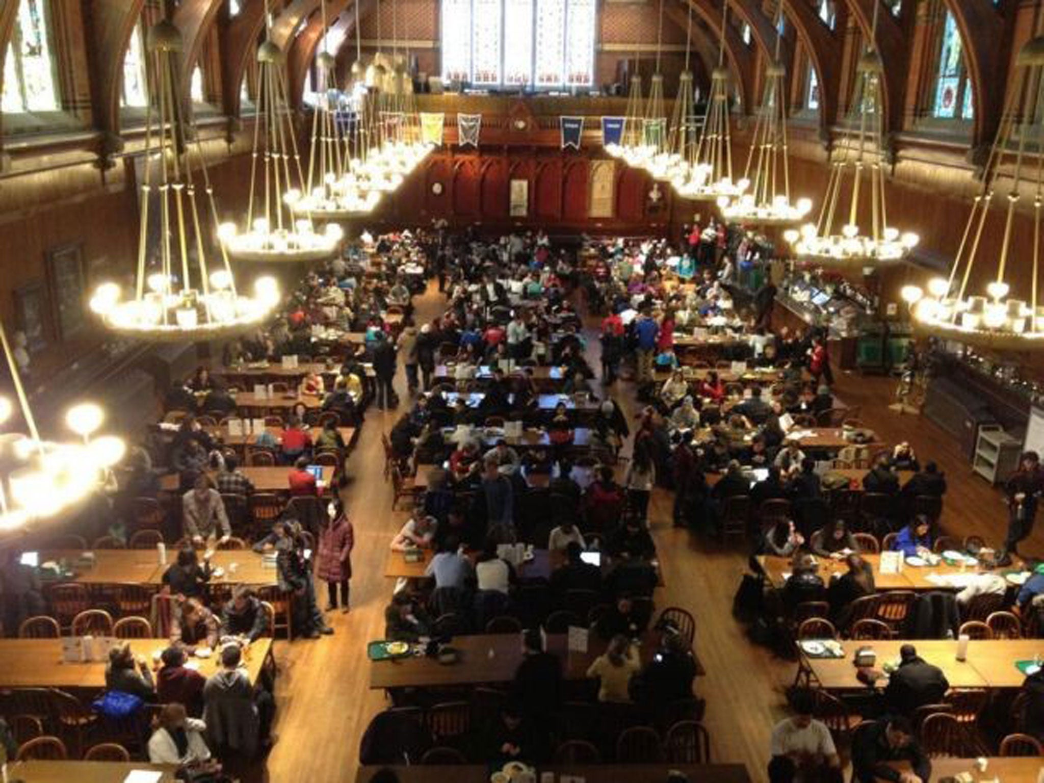 Students gather at Harvard University's Annenberg Hall after being evacuated from campus buildings following an unconfirmed bomb threat