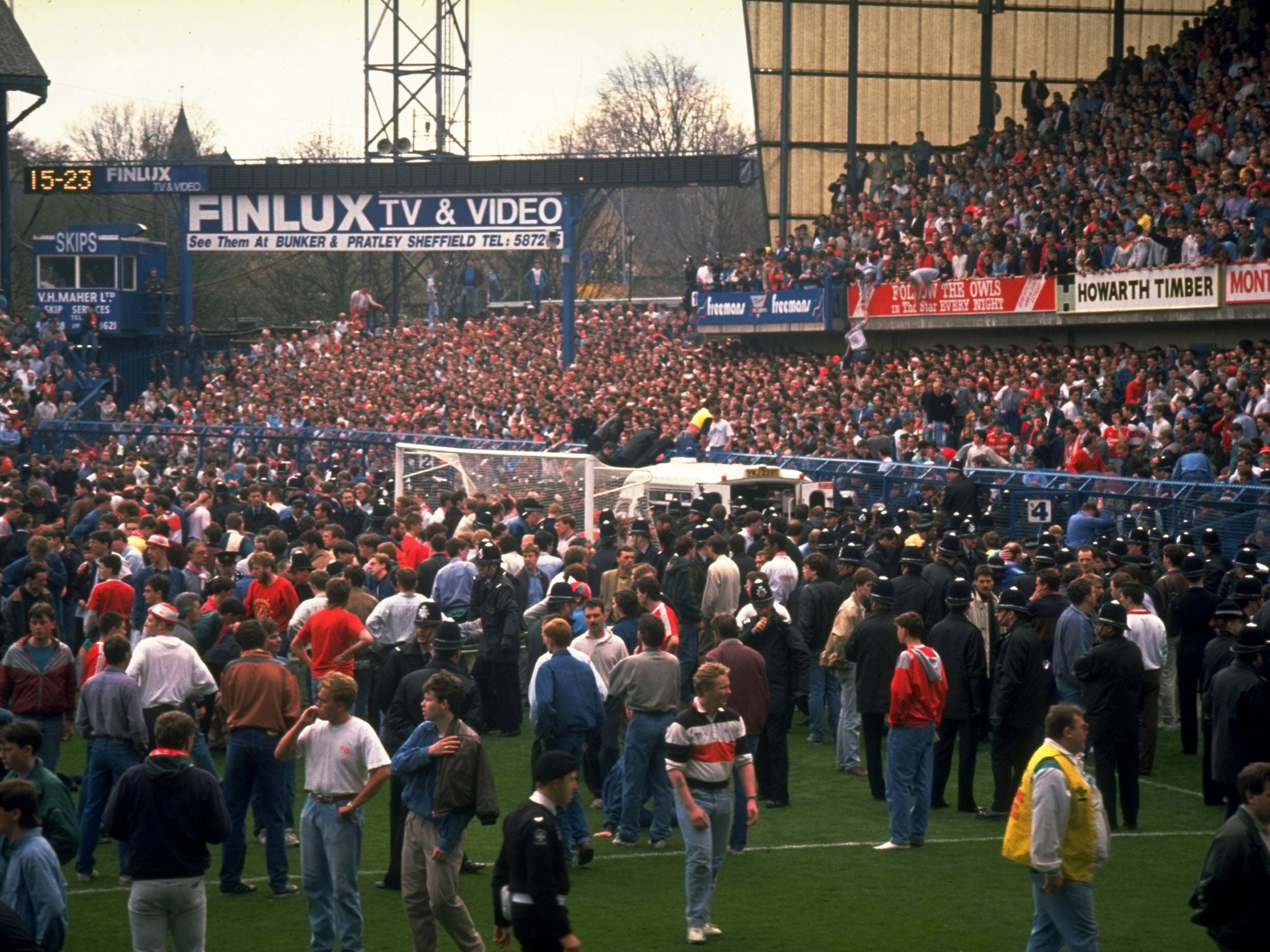 Supporters are crushed against the barrier as disaster strikes before the FA Cup semi-final match between Liverpool and Nottingham Forest - police footage of the day contains a 10-minute gap in one of the tapes