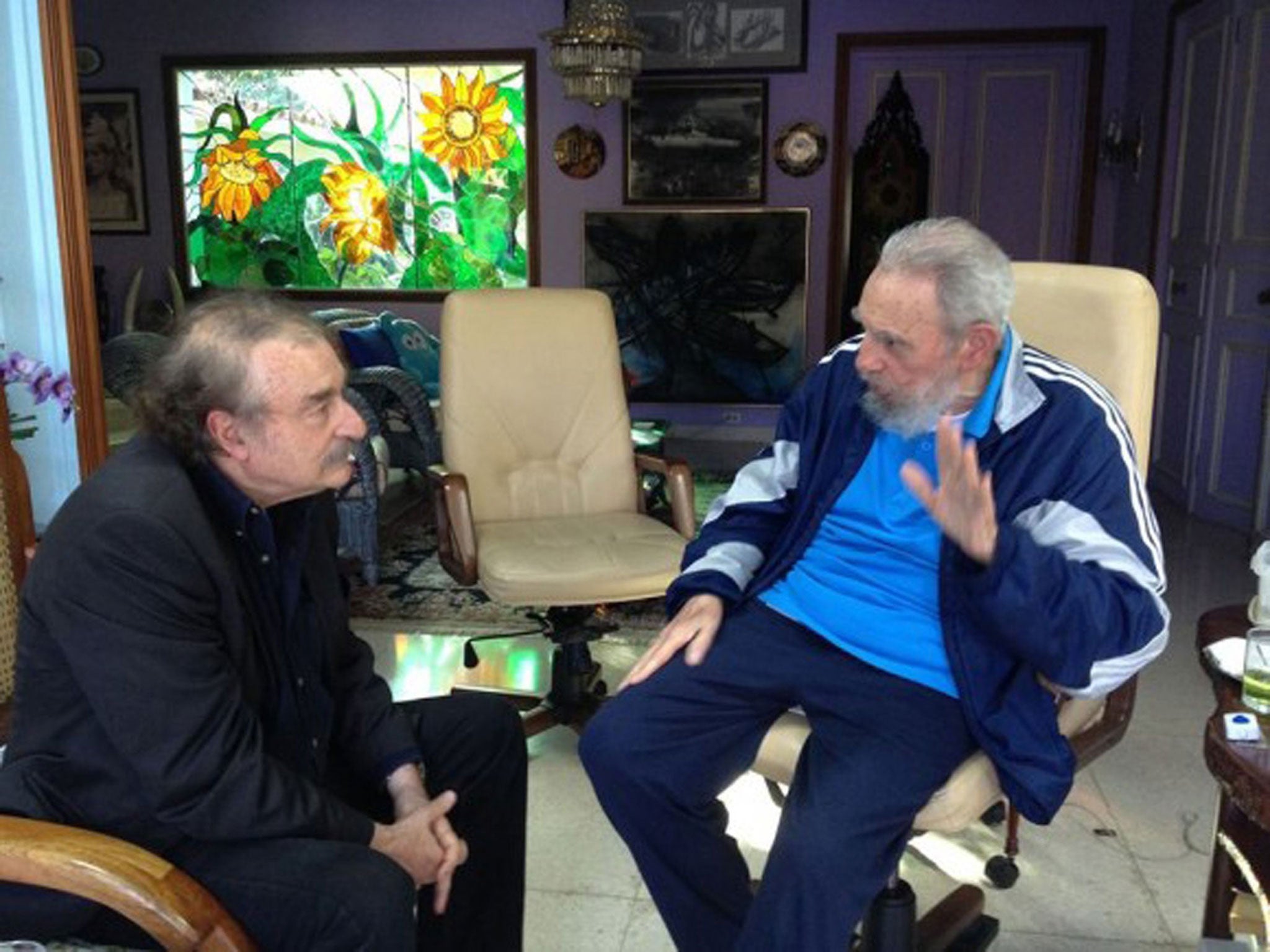 Cuban leader Fidel Castro, right, talks with Spanish journalist, writer and former editor-in-chief of Le Monde diplomatique, Ignacio Ramonet in Havana, Cuba