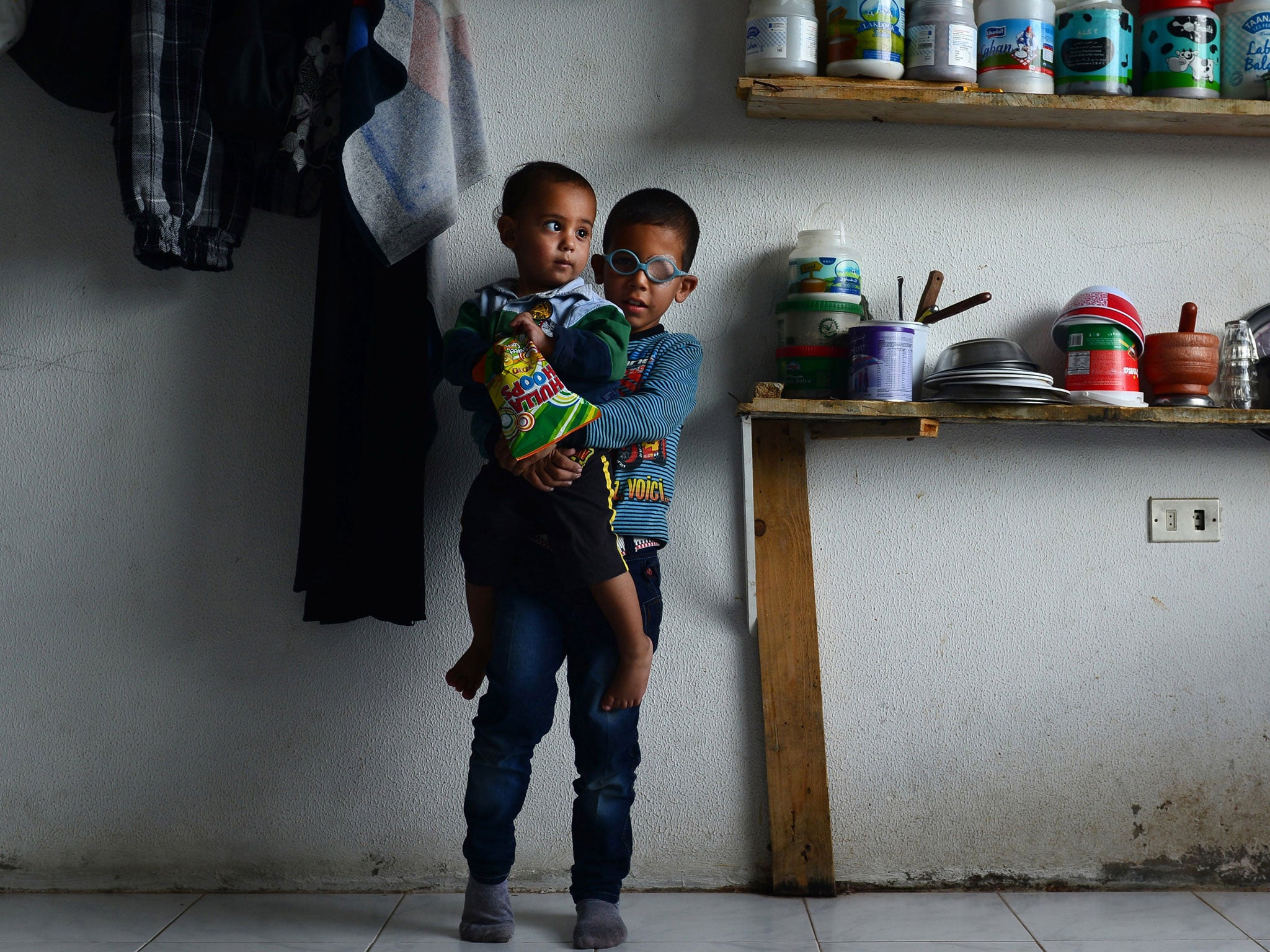 Refugees Mohammad al-Khalid, four, and his brother Ahmed, one, are both battling eye cancer