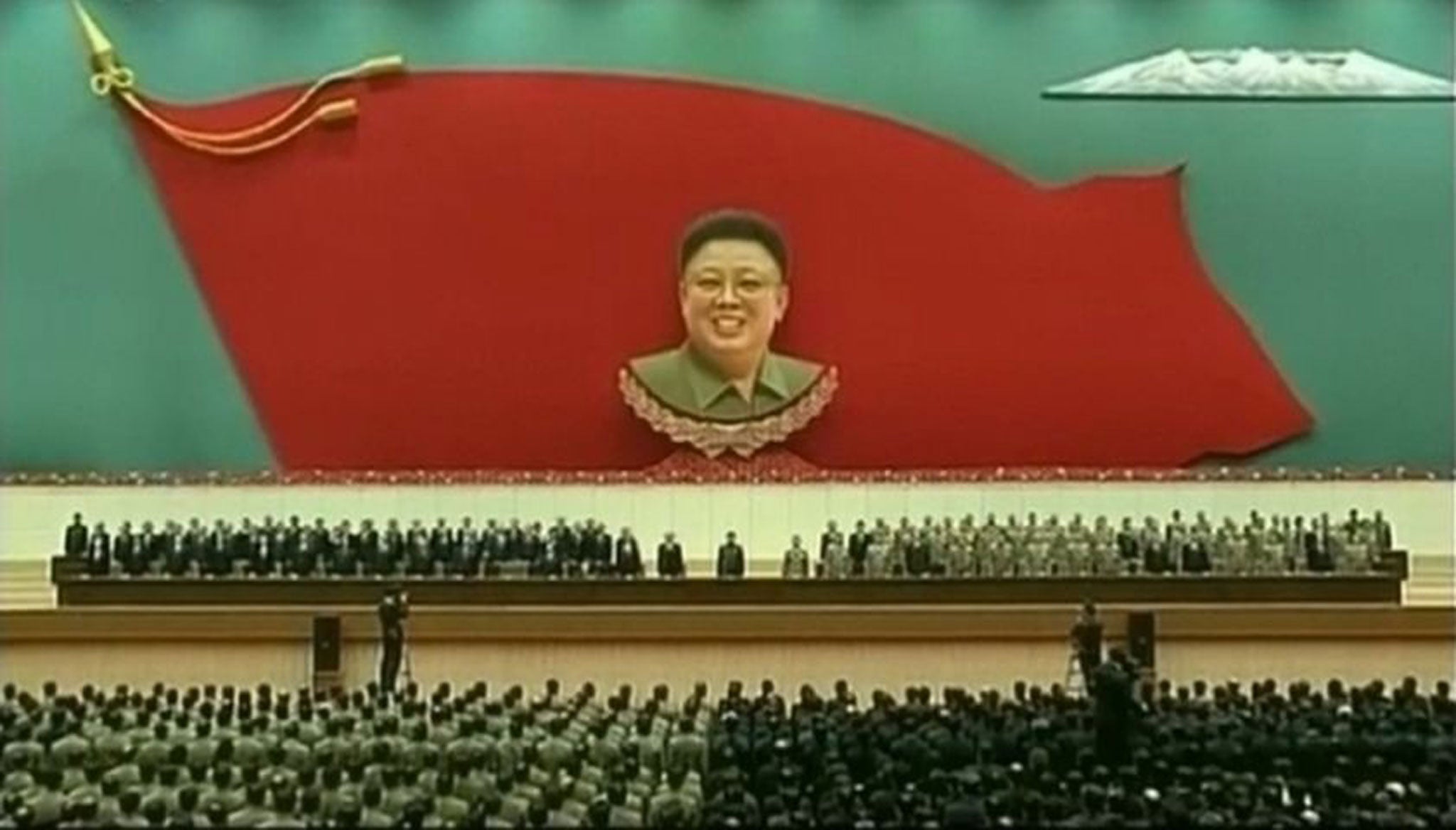 In this image taken from state media coverage, North Korean leader Kim Jong Un, centre, attends an event to mark the second anniversary of the death of his father, former leader Kim Jong Il