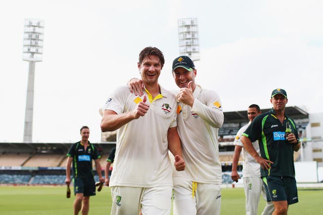 Michael Clarke and Shane Watson of Australia celebrate on the pitch after day five of the Third Ashes Test Match between Australia and England