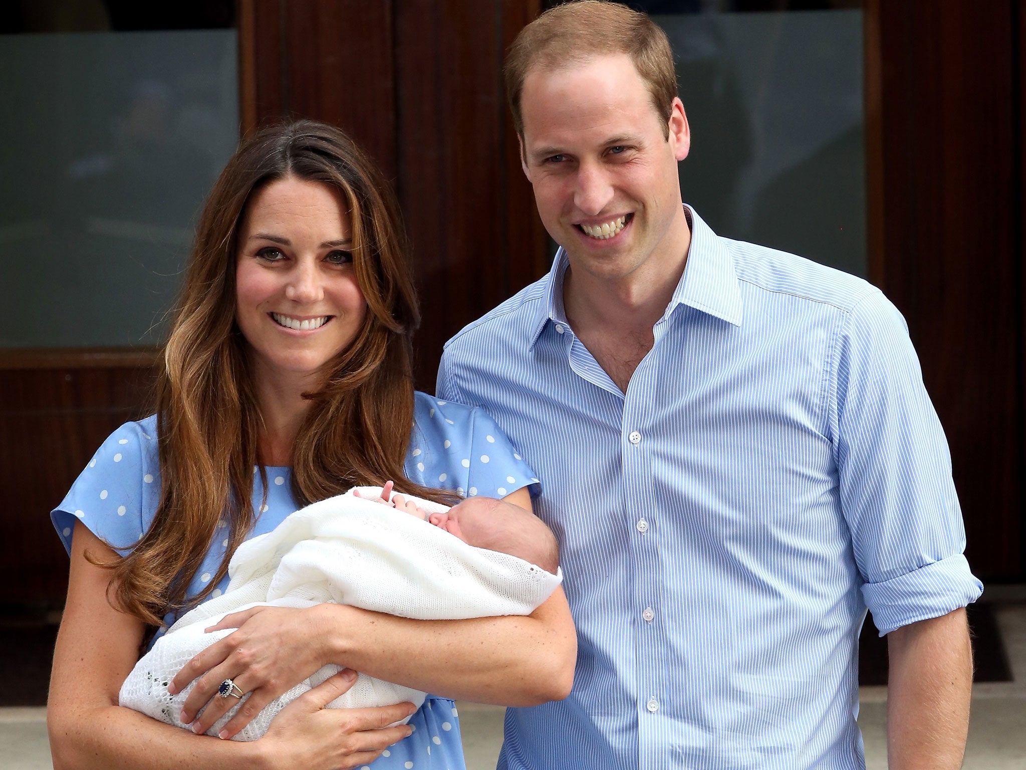 The Duke and Duchess of Cambridge poses with Prince George after he was born.