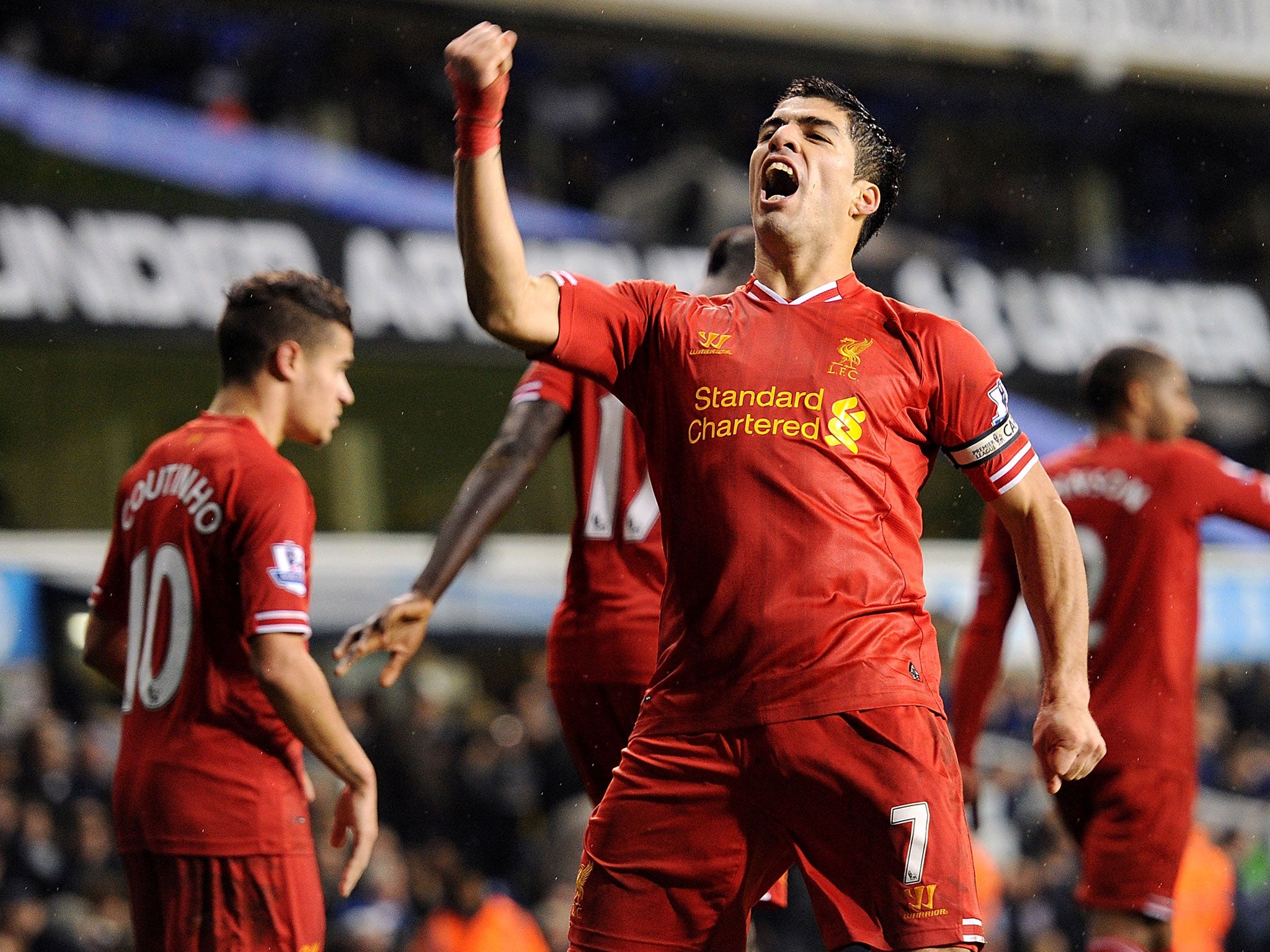 Liverpool striker Luis Suarez celebrates after scoring against Tottenham