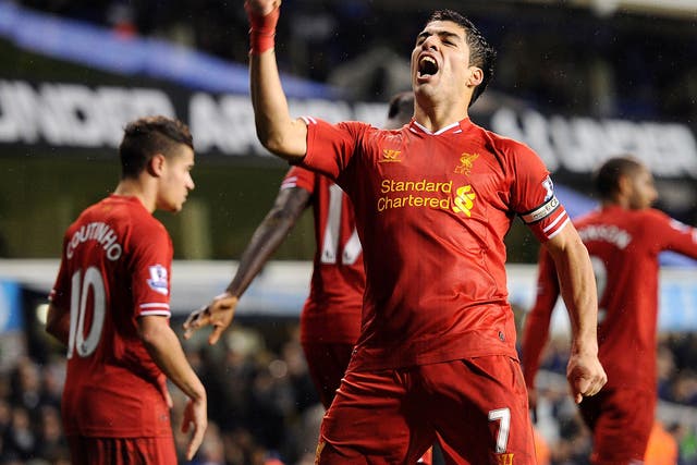 Liverpool striker Luis Suarez celebrates after scoring against Tottenham
