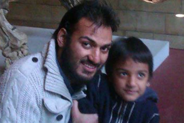 British surgeon Dr Abbas Khan, pictured here with his son, died in detention.