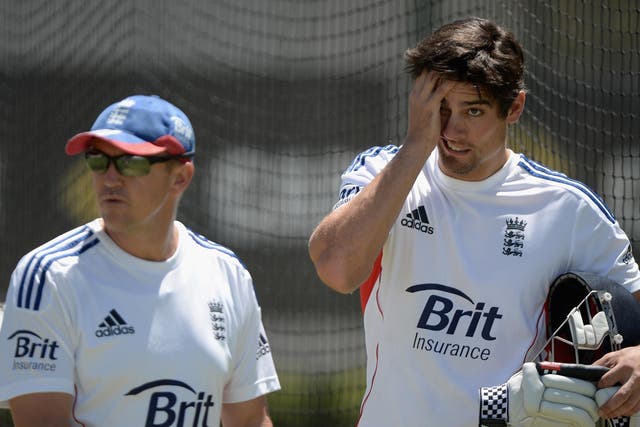 England captain Alastair Cook speaks with coach Andy Flower 