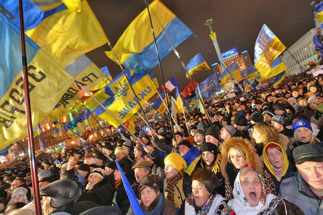 Ukrainian protesters shout slogans during a mass opposition rally in Independence Square in Kiev 