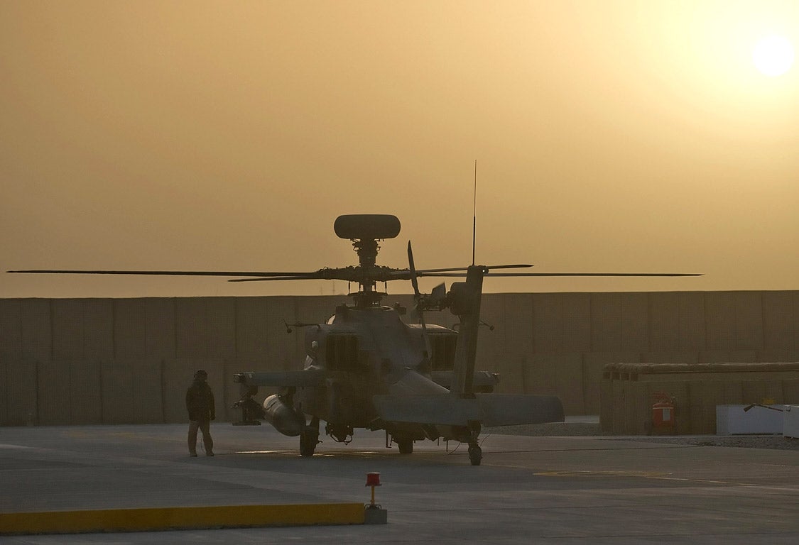 A rapid-response Apache helicopter waits for an emergency call at Camp Bastion