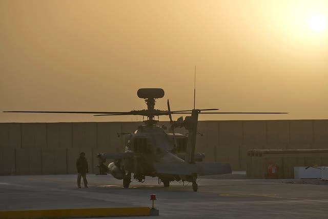 A rapid-response Apache helicopter waits for an emergency call at Camp Bastion