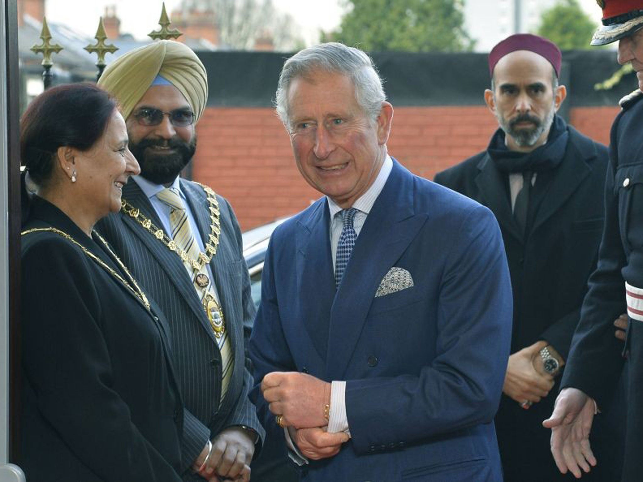 Britain's Prince Charles and Prince Ghazi bin Mohammad of Jordan (right) arrive for a visit to a Syriac Orthodox Church in west London
